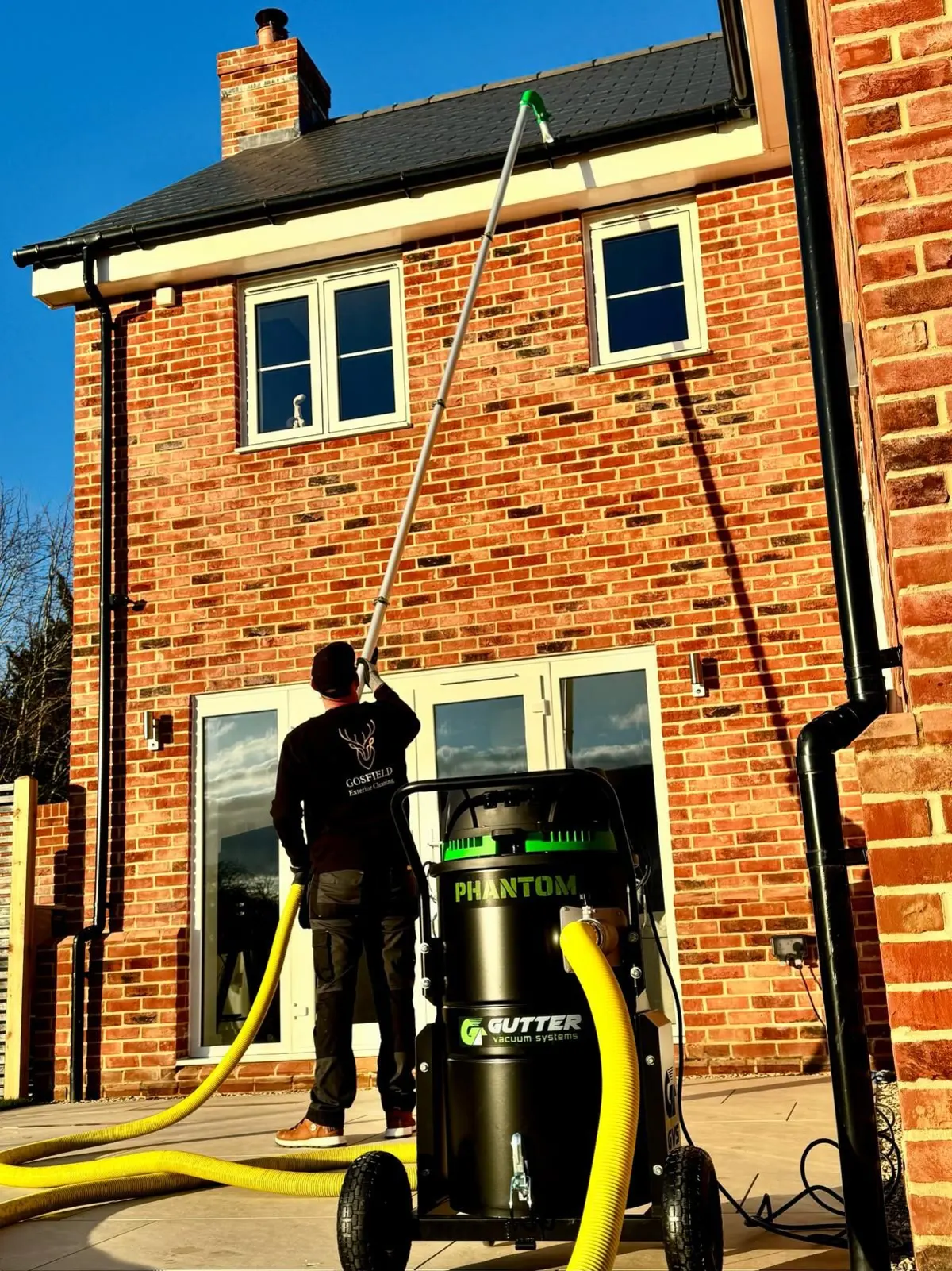 Gutter cleaning in Braintree using a high-reach gutter vacuum system